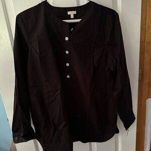 Black casual top. The buttons are sparkly.
